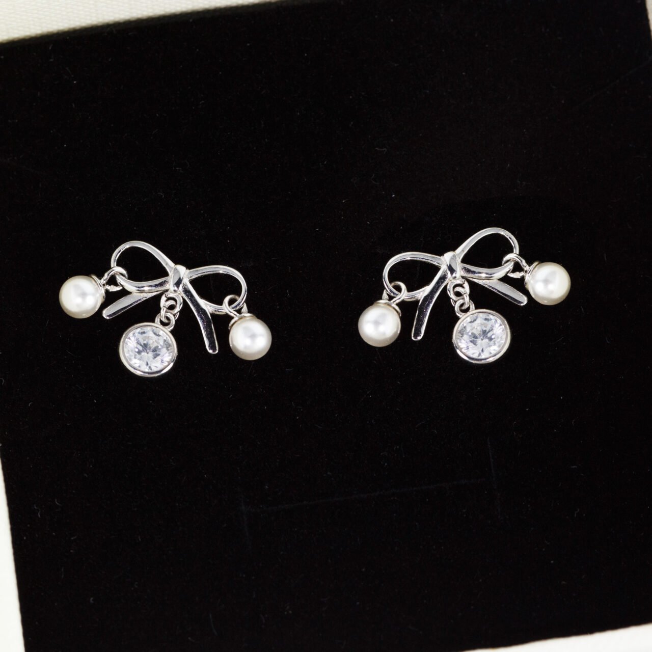 Elegant silver butterfly stud earrings with sparkling zirconia drops