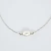 Delicate silver chain bracelet with a single white pearl centerpiece.