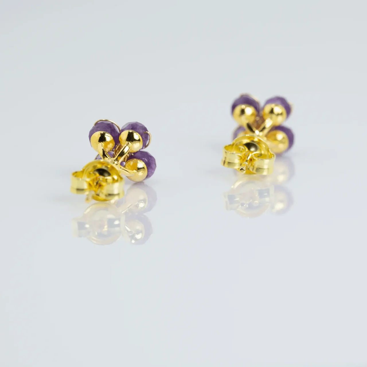 Stylish purple amethyst flower stud earrings with gold accents, gemstones