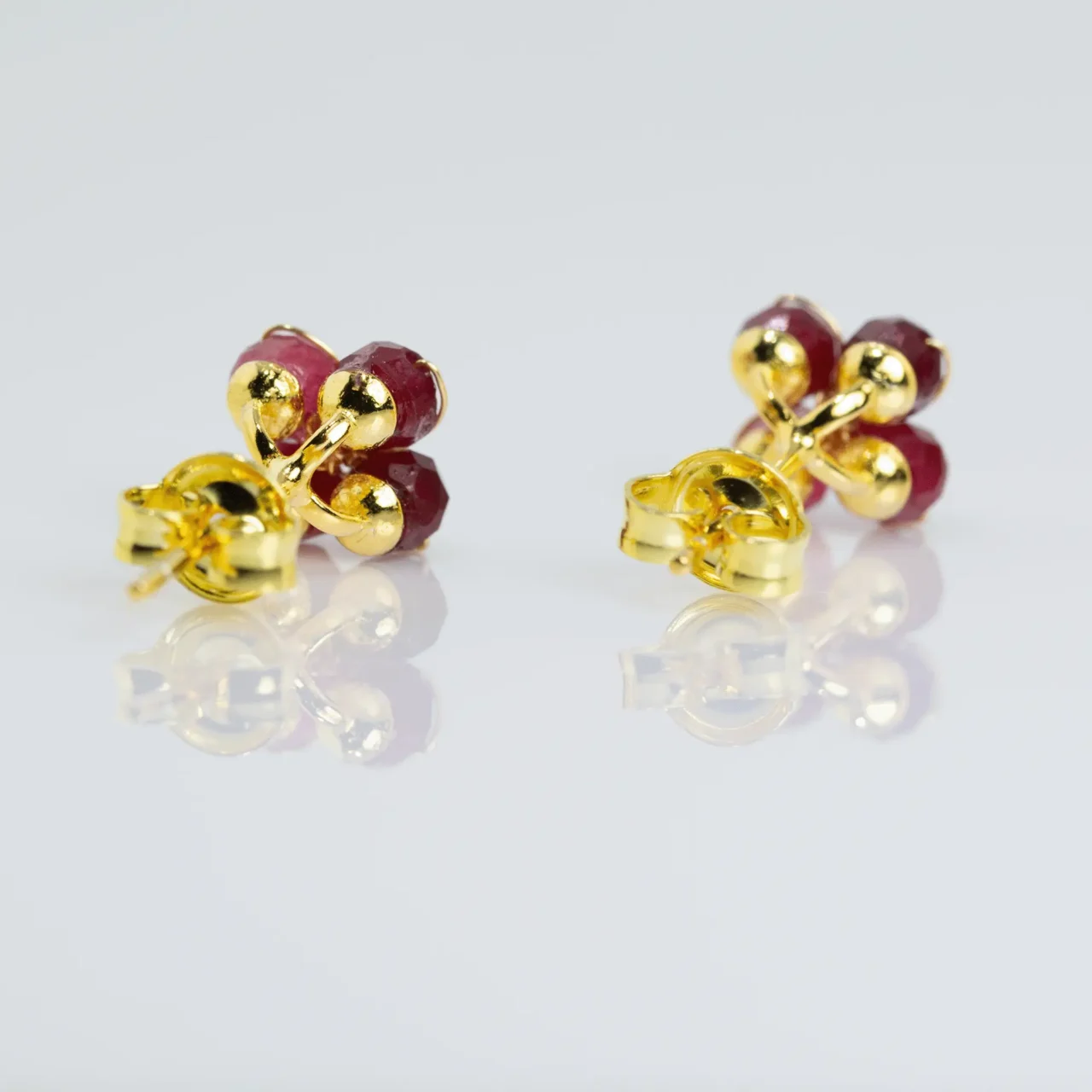 Elegant red jasper flower stud earrings with gold accents, gemstone